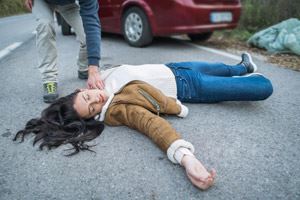 Woman lying on the road